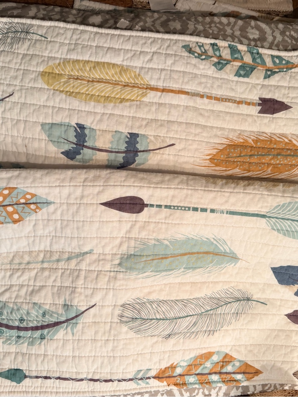 Rod’s True Western Feather and Arrow print quilt in Cream, Teal & Mustard.